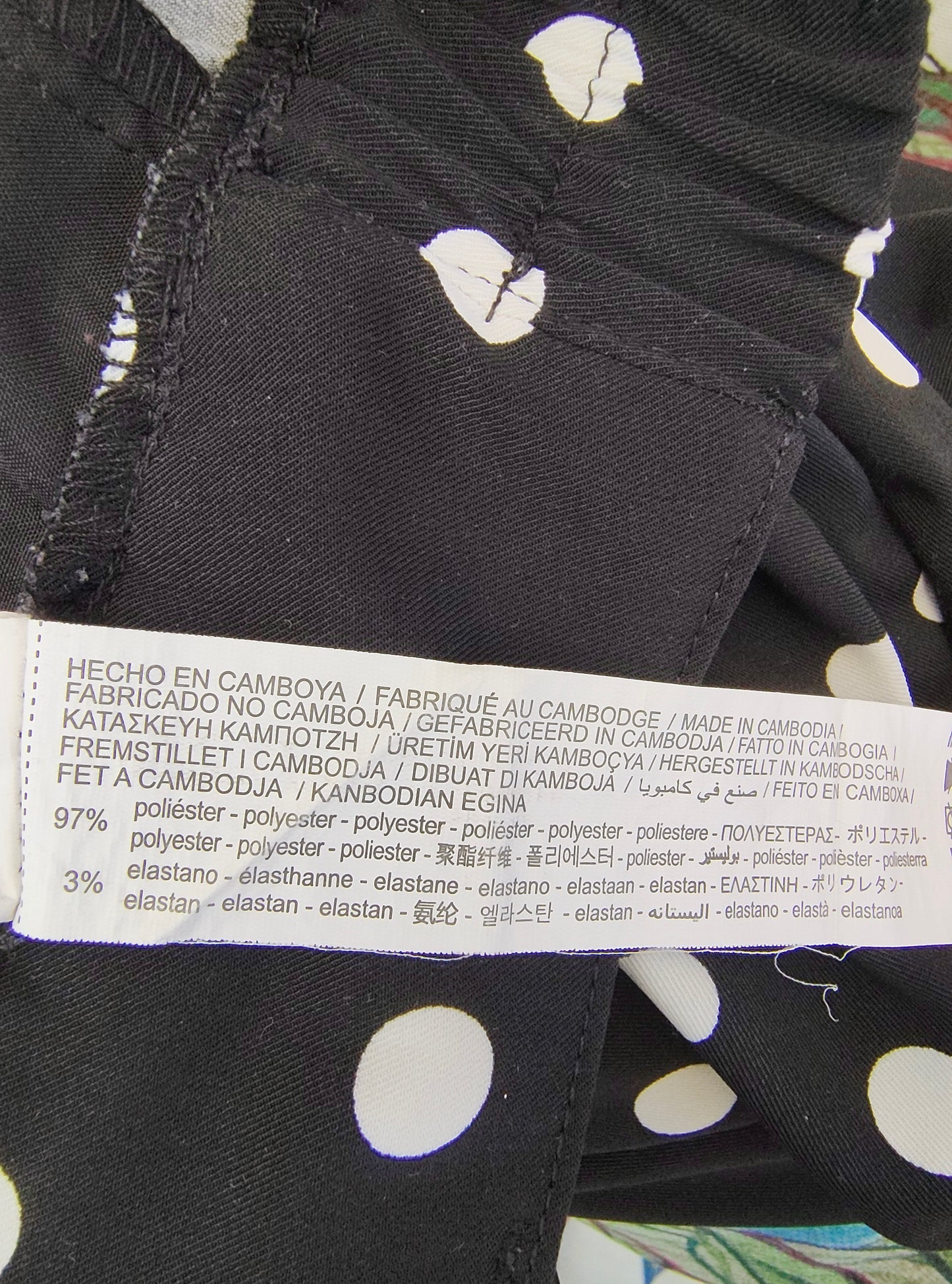 D'OCCASION – Pantalon noir à pois blancs longueur cheville de STRADIVARIUS (Taille 34 EUR)