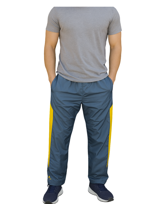 D'OCCASION – Pantalon de survêtement Adidas gris-bleu avec bandes latérales jaunes (Taille M)