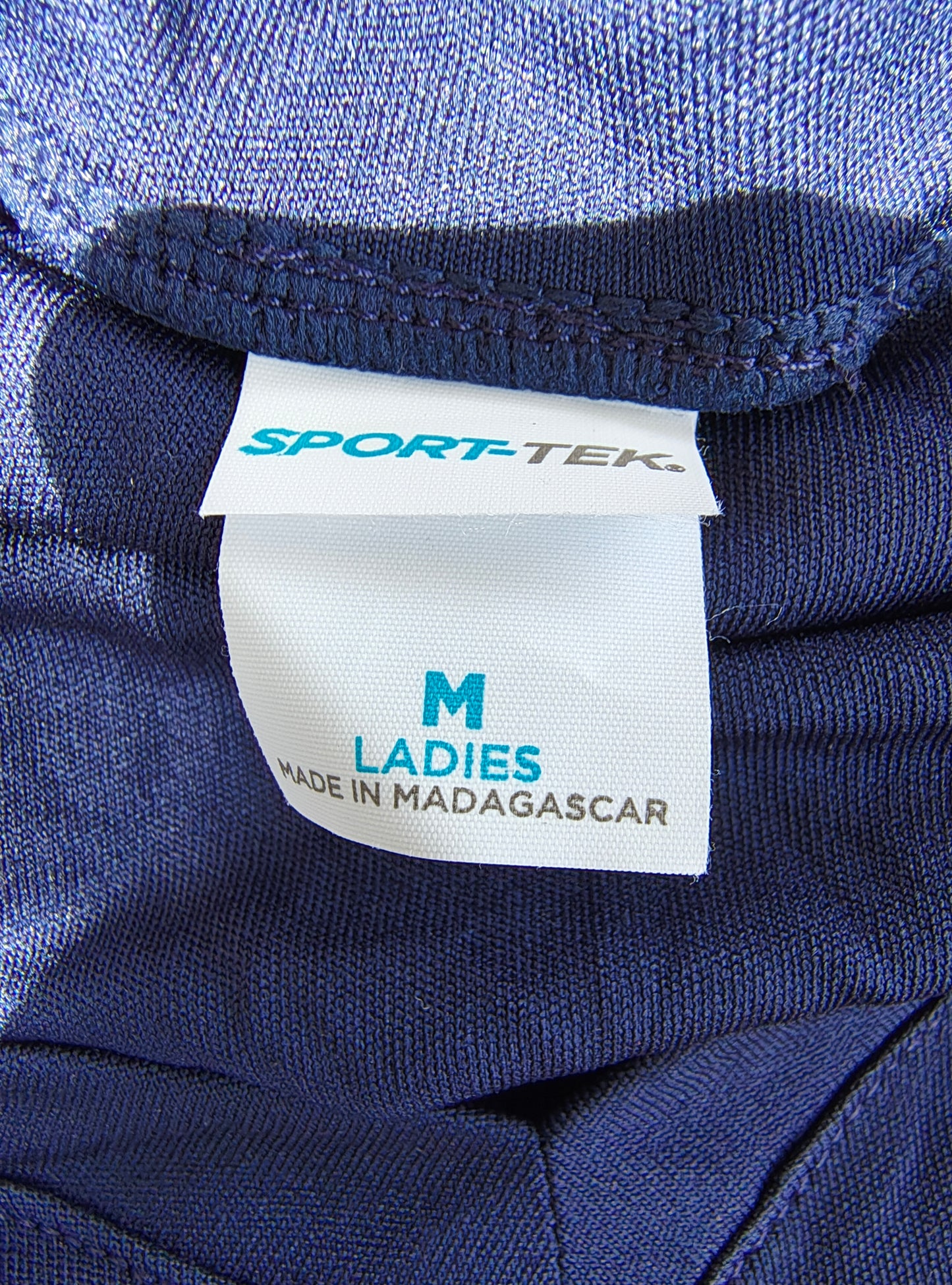 D'OCCASION – T-shirt de sport bleu marine SPORT-TEK avec logo « Miami » (taille M)