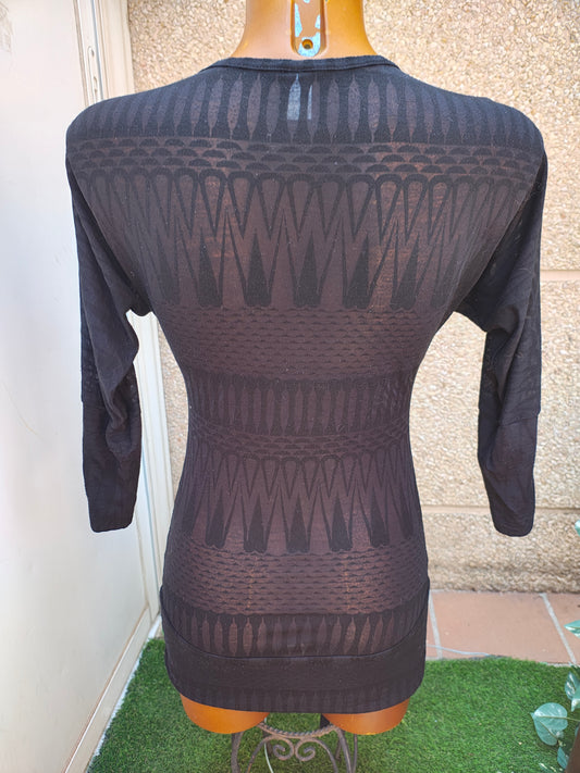 USADO – Vestido negro con estampado geométrico y escote pico (talla no visible, aprox S)