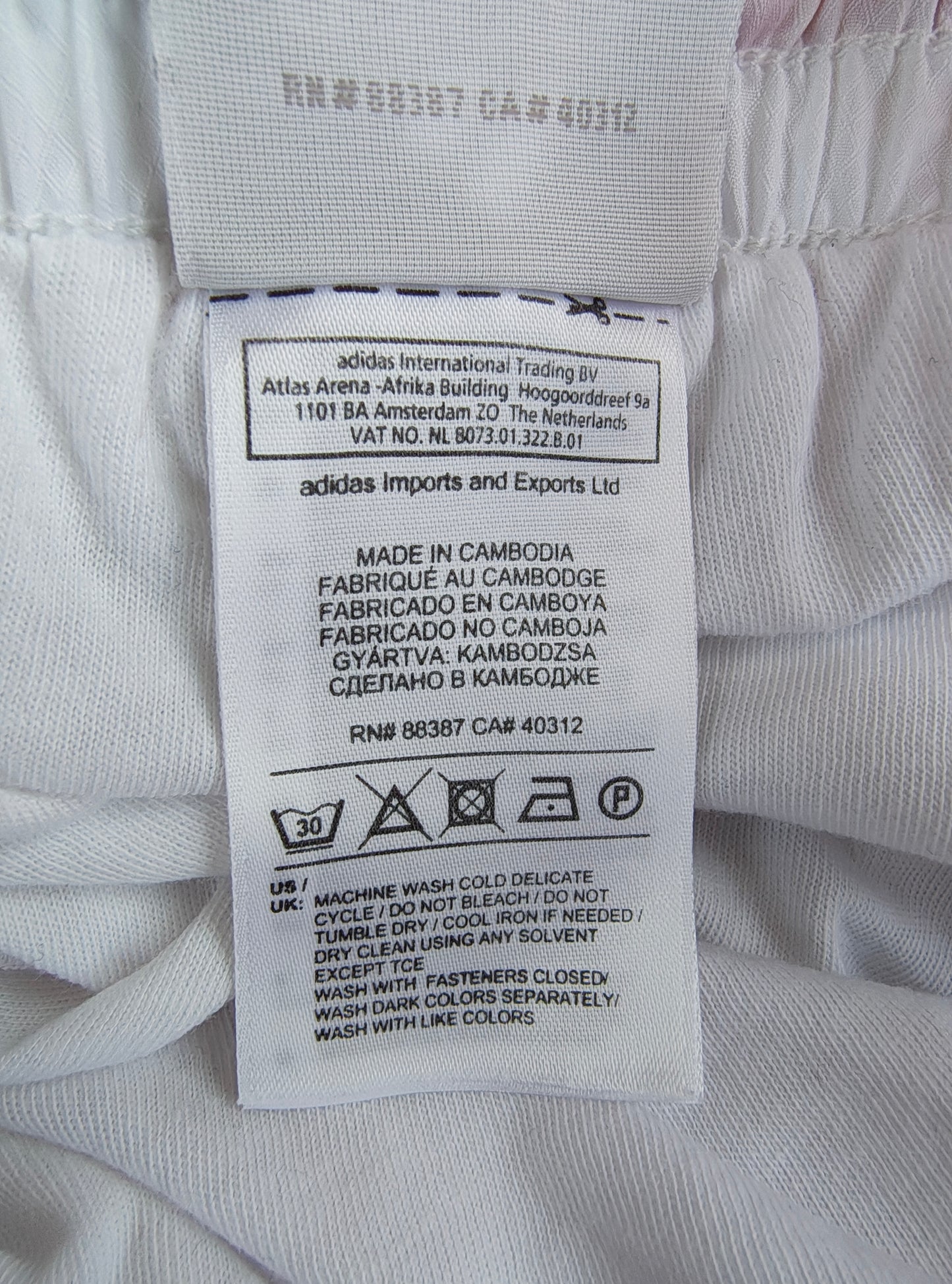 USADO – Pantalón deportivo Adidas blanco con franjas rojas (Talla M)